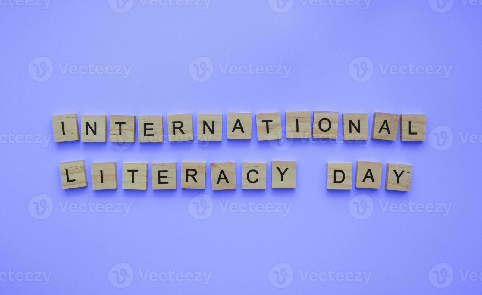 September 8, International Literature Day, minimalistic banner with the inscription in wooden letters photo