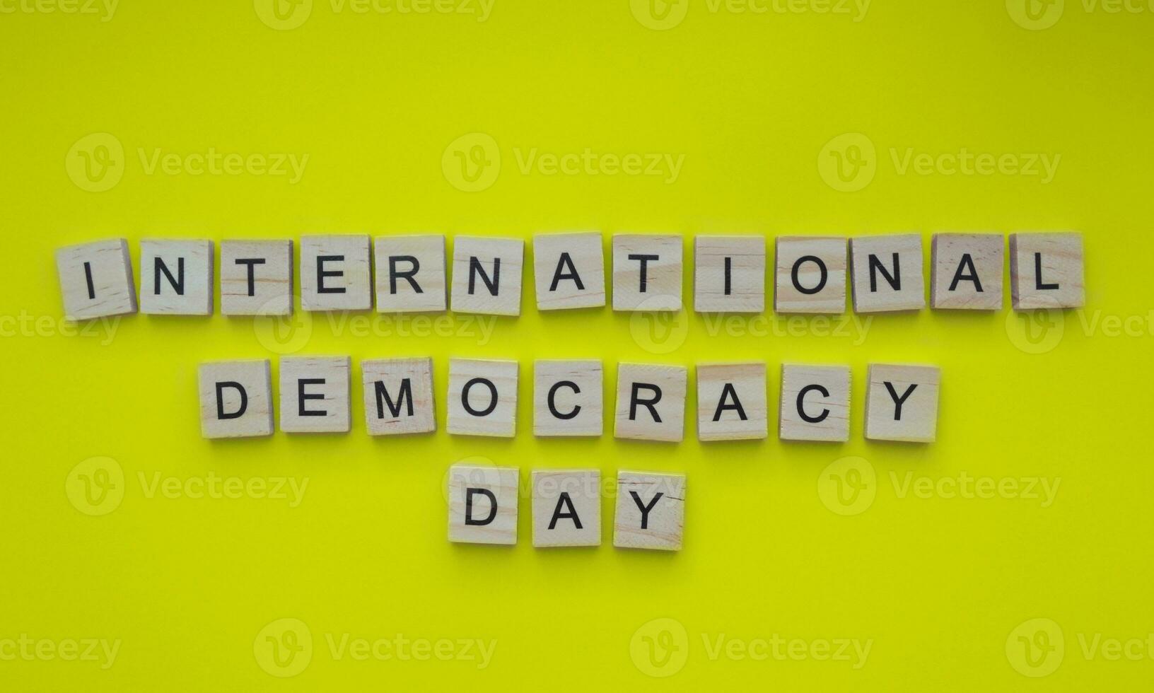 September 15, International Day of Democracy, minimalistic banner with the inscription in wooden letters photo