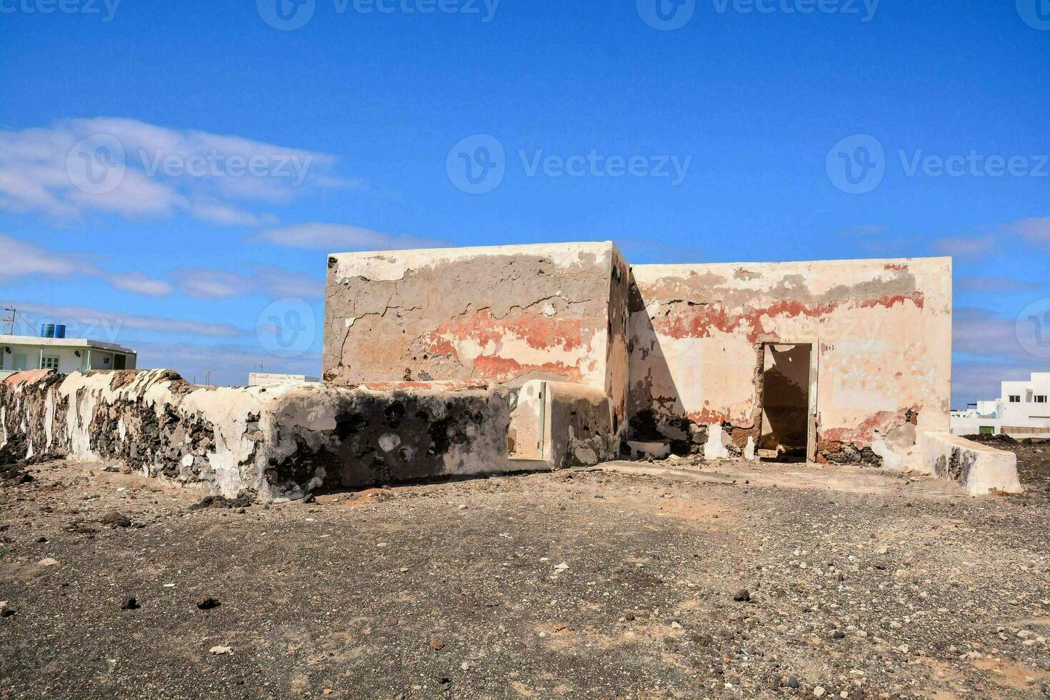 an old building with fading paint photo