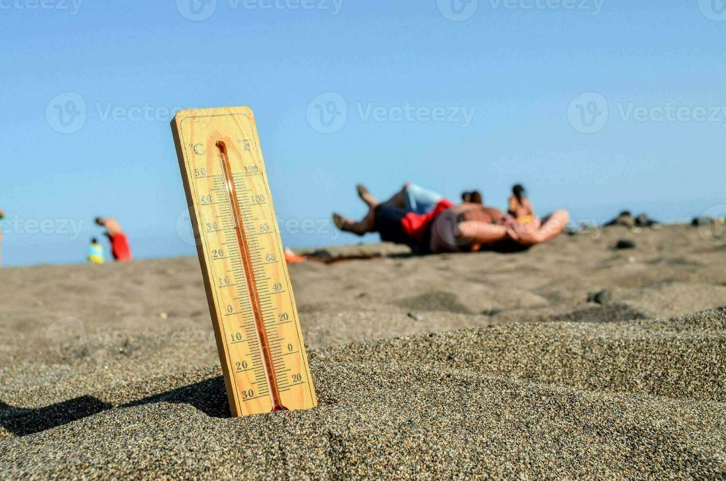 a thermometer on the beach photo