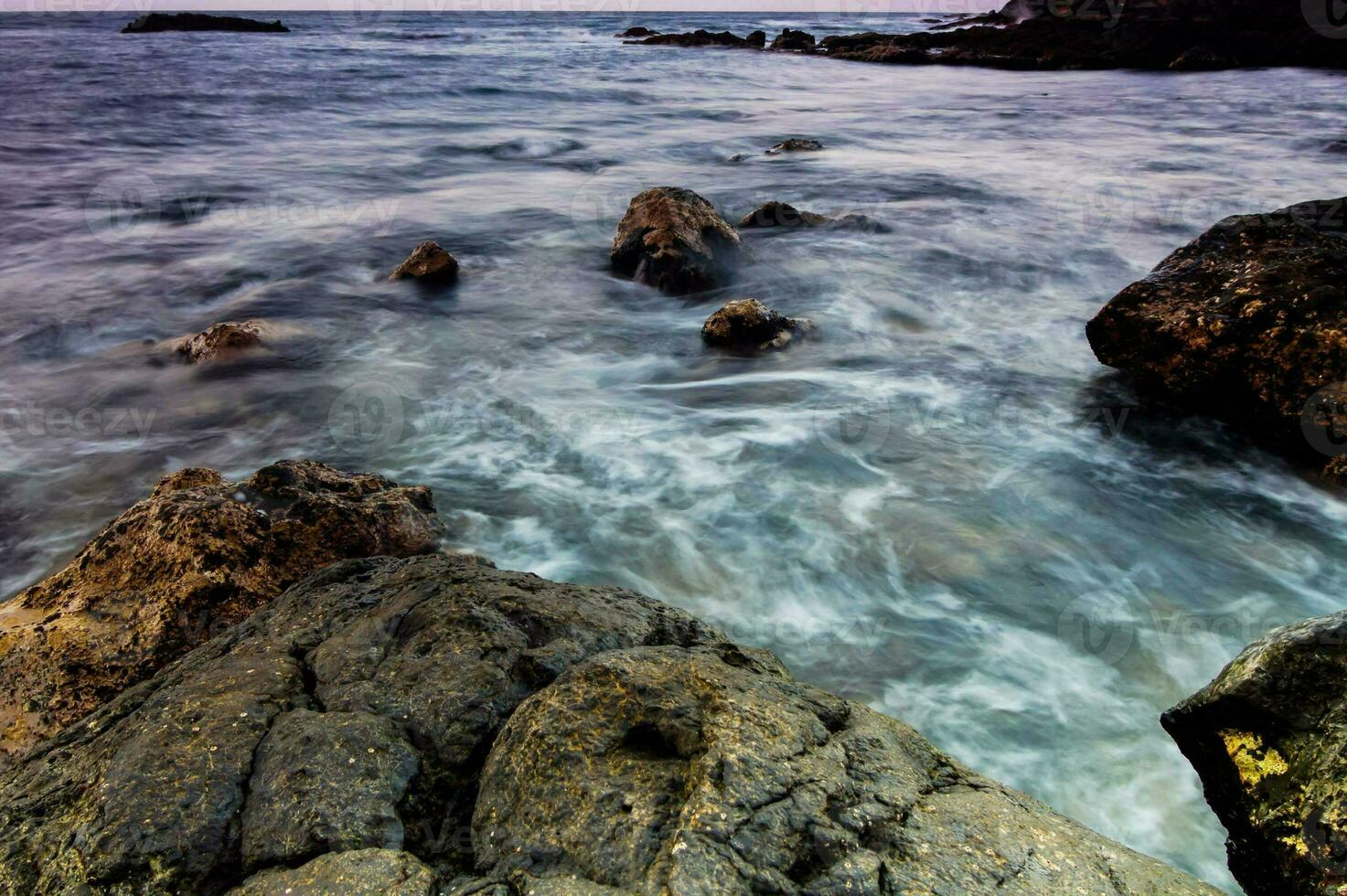 rocks in moving water photo