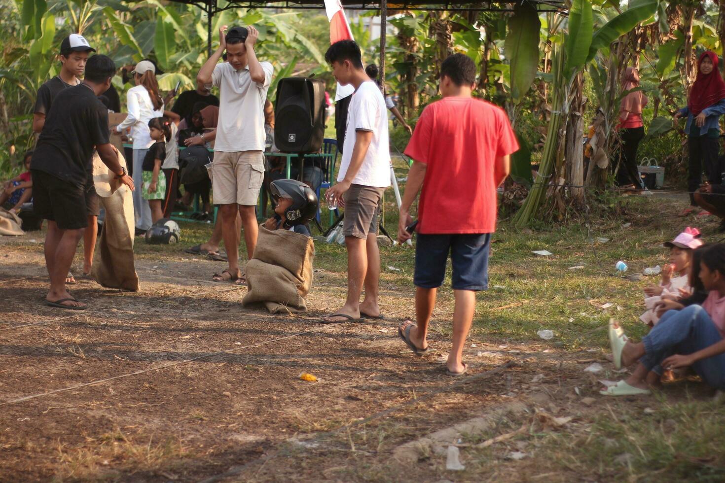 Magelang Indonesia.08 05 2023- sack race during indonesia independence day photo