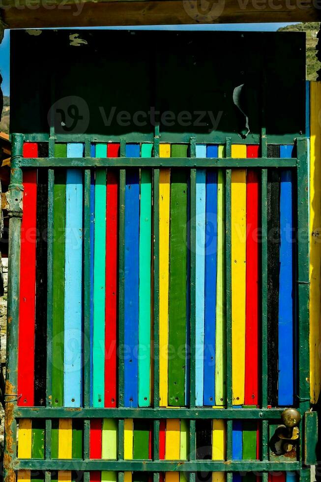 a colorful painted metal gate photo