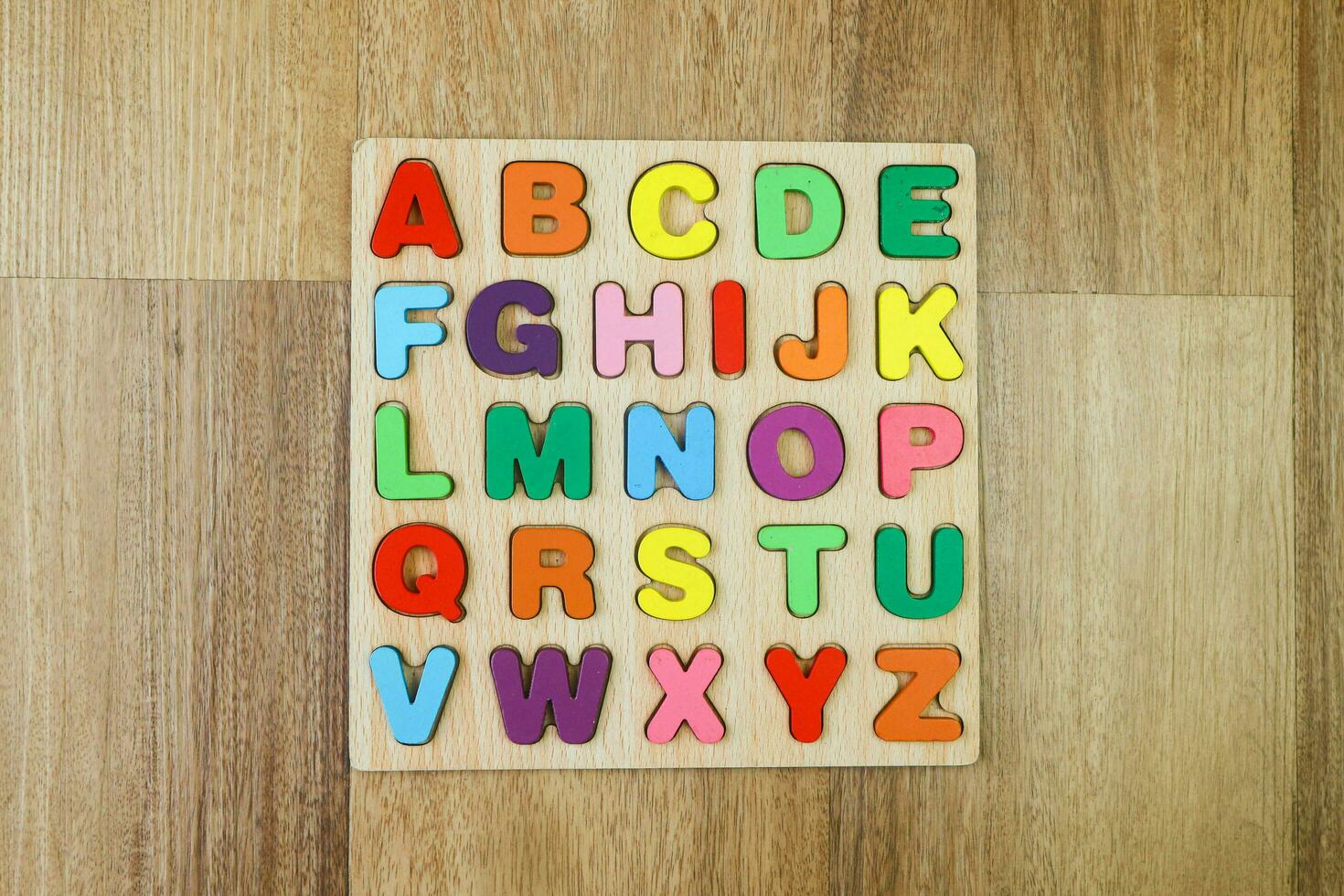 Wooden Alphabet letter puzzle board photo