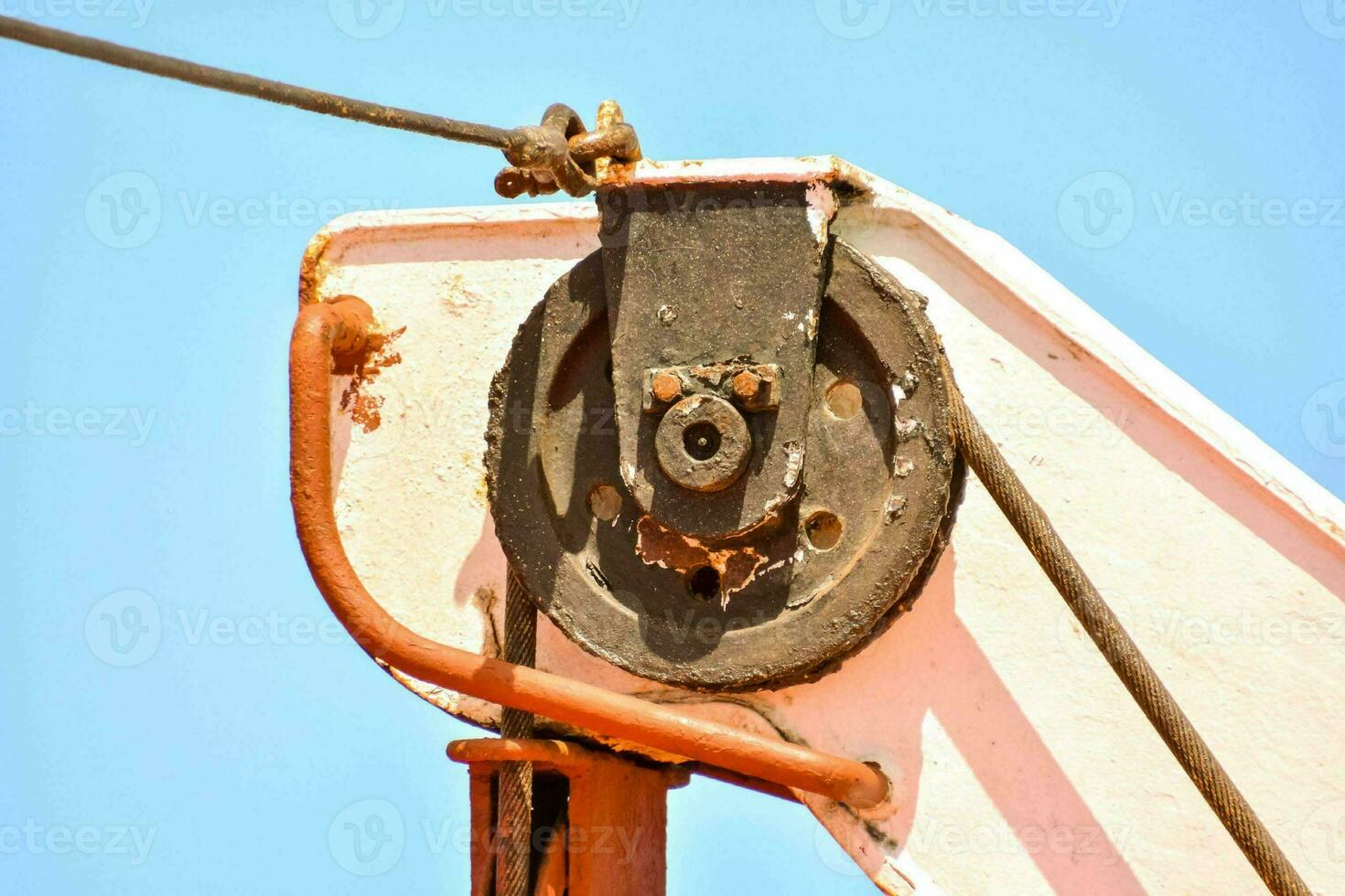 a close up of a rusted metal sailboat part photo