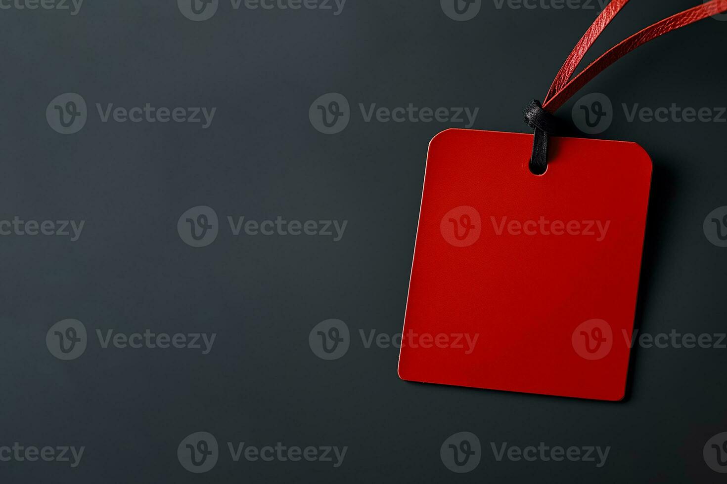 Red empty price tag on black or dark background. Black Friday concept, template copyspace photo