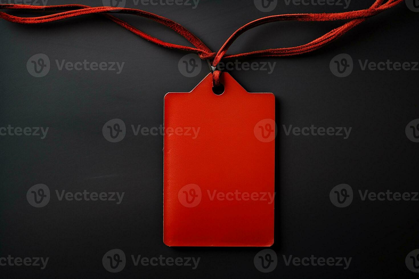 Red empty price tag on black or dark background. Black Friday concept, template copyspace photo