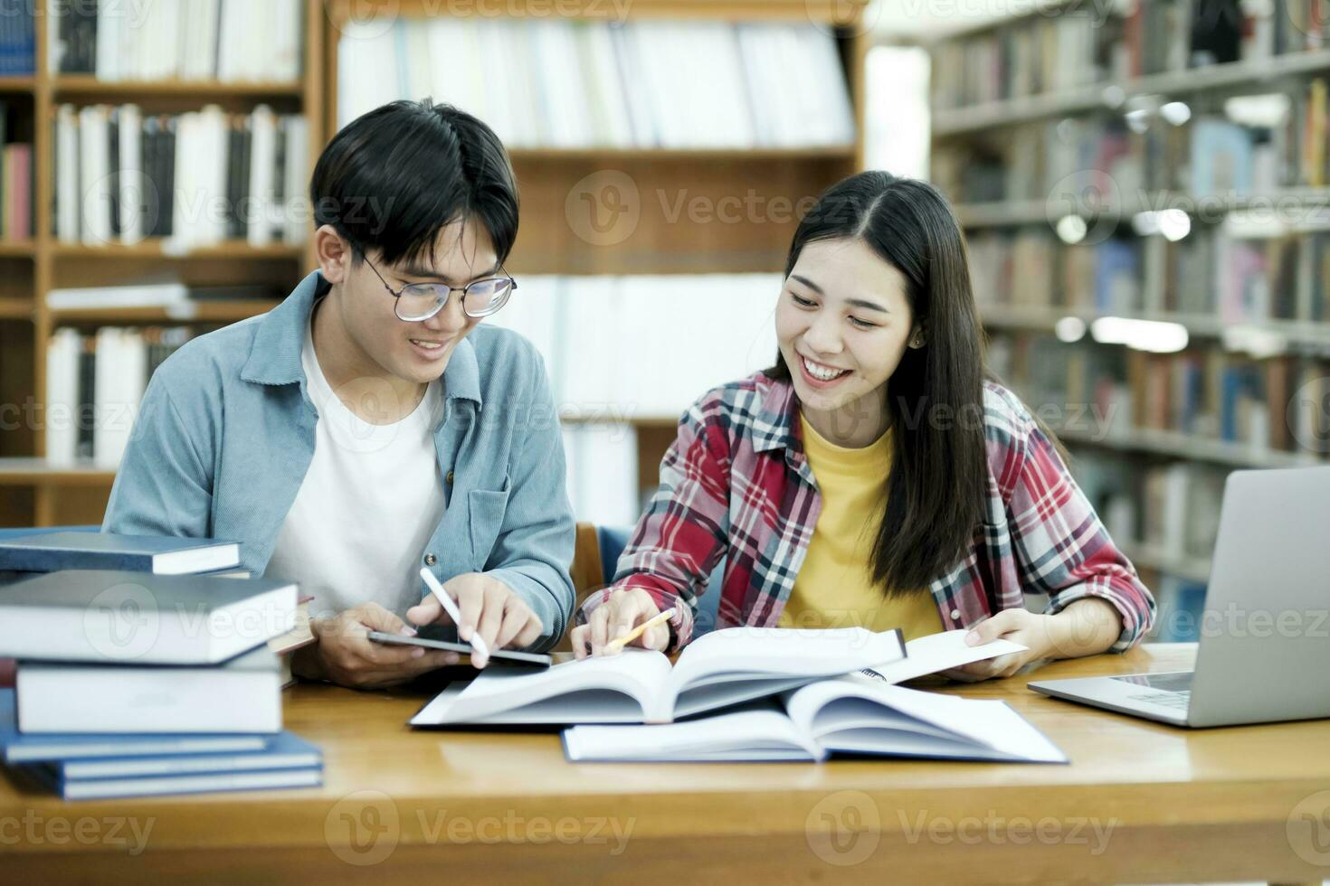 Young students campus helps friend catching up and learning. photo