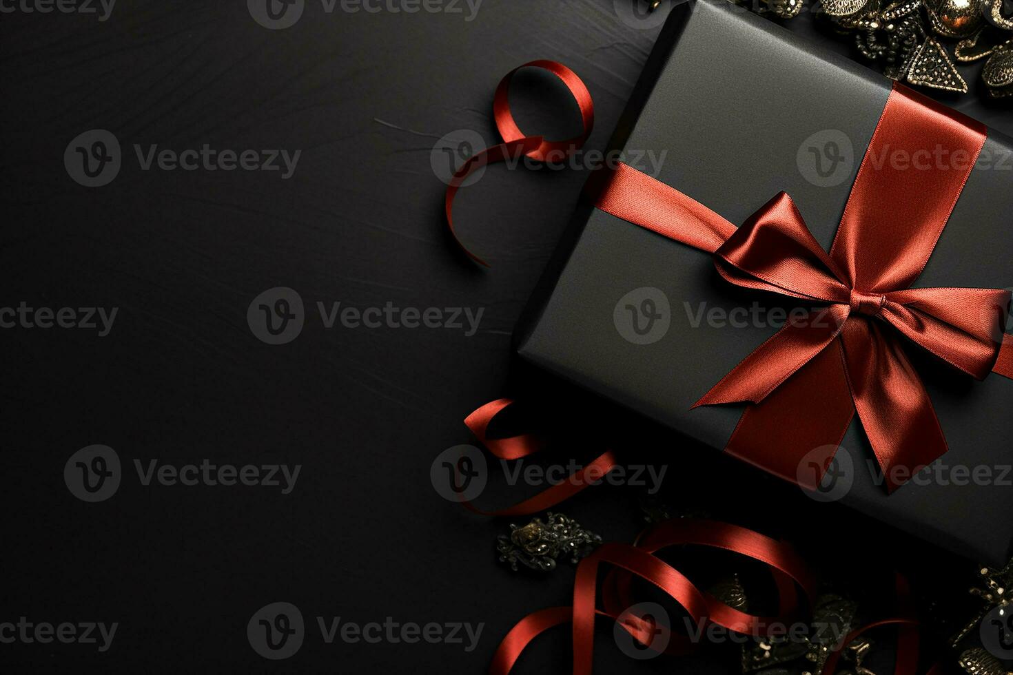 Black gift box on black background with empty space for text. photo