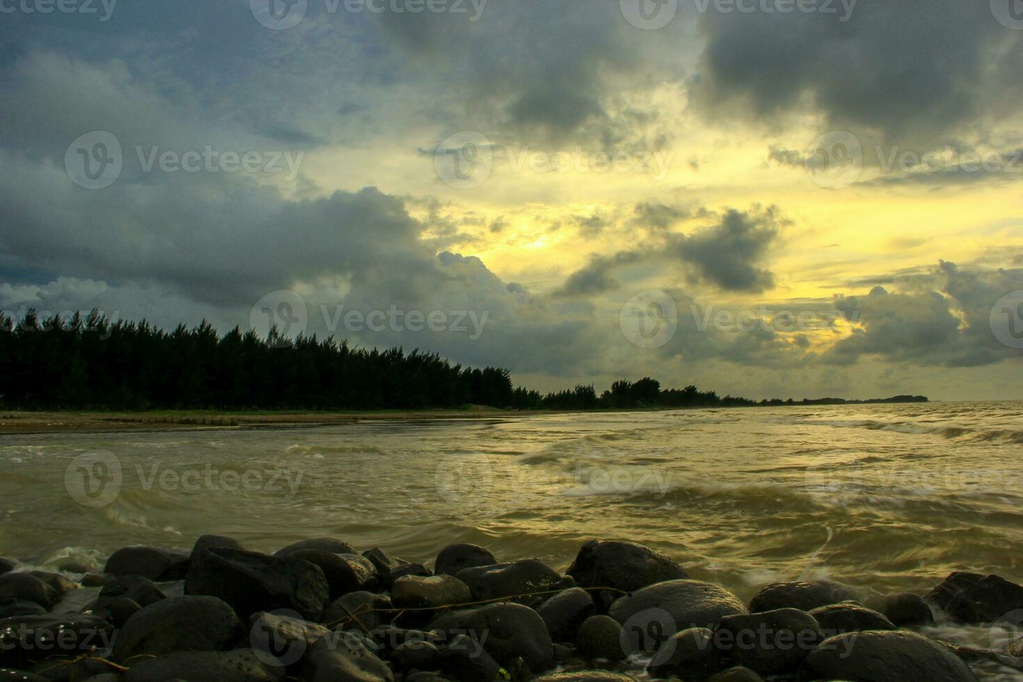 Sunset on the beach. Sunset landscape over the beautiful rocky coastline in the Sea. sunset over the river photo