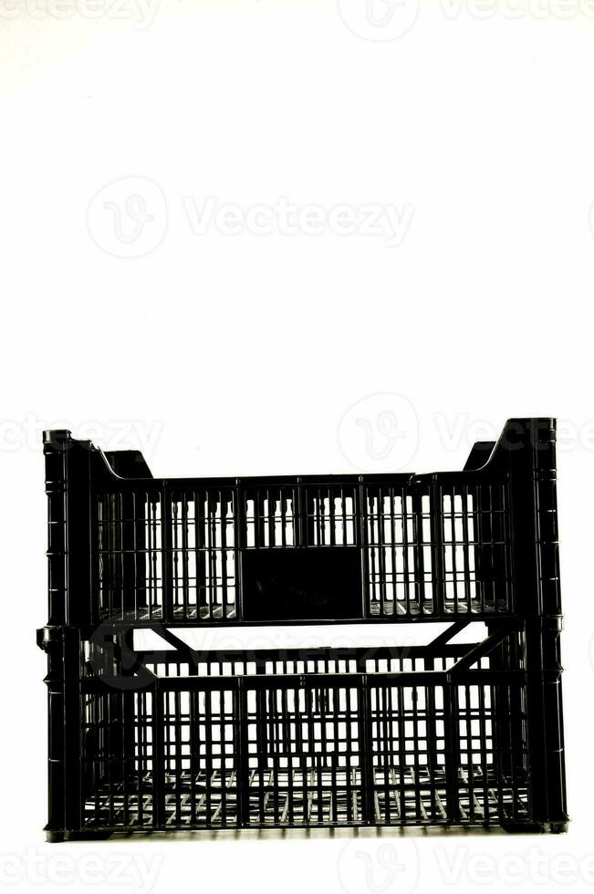 a black plastic crate with a white background photo