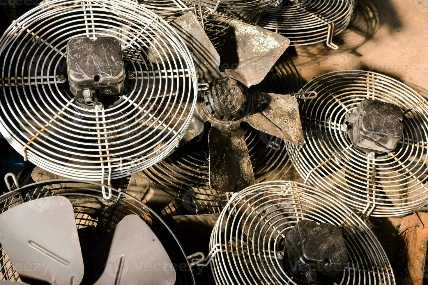 a pile of old metal fans photo