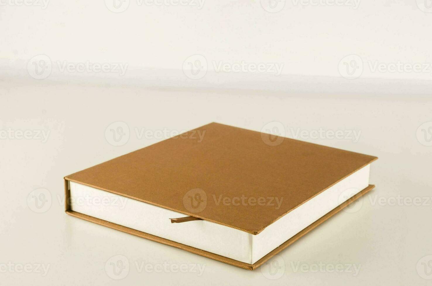 a book with a brown cover sitting on a table photo