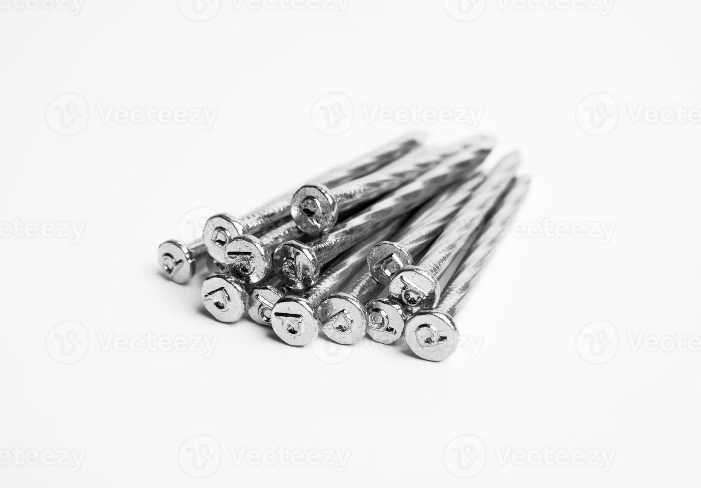 Pile Of Silver Shiny Sharp Metal Nails Closeup Photo Isolated On White Background