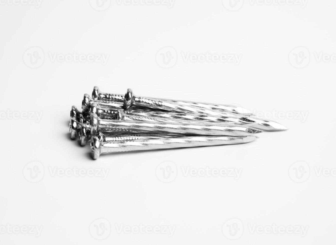 Pile Of Silver Shiny Sharp Metal Nails Closeup Photo Isolated On White Background