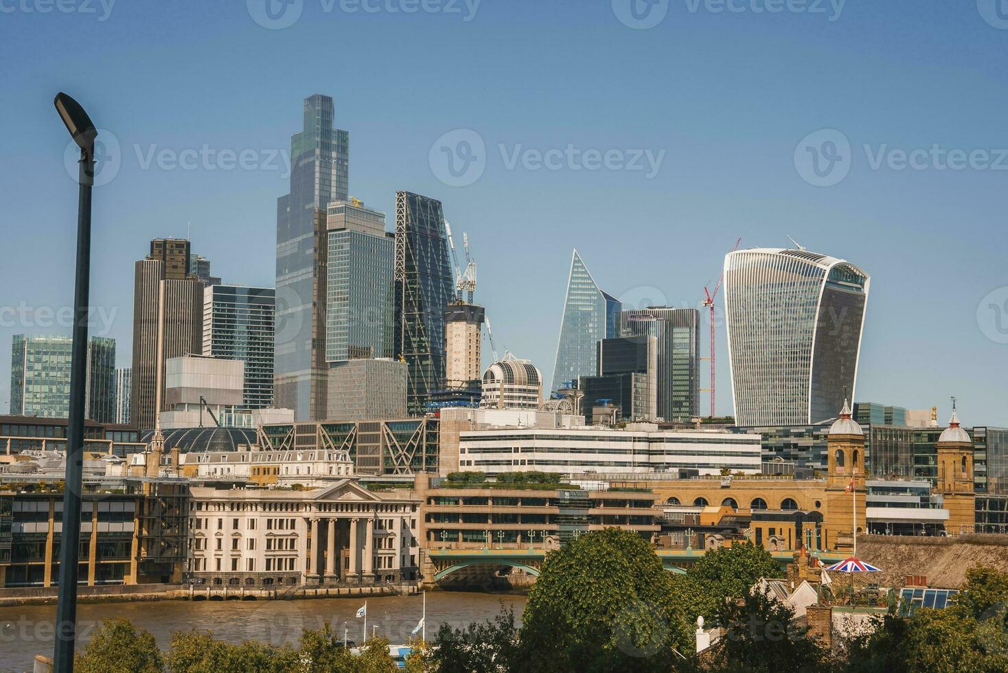 Skyscrapers with clear blue sky in background at London on sunny day photo