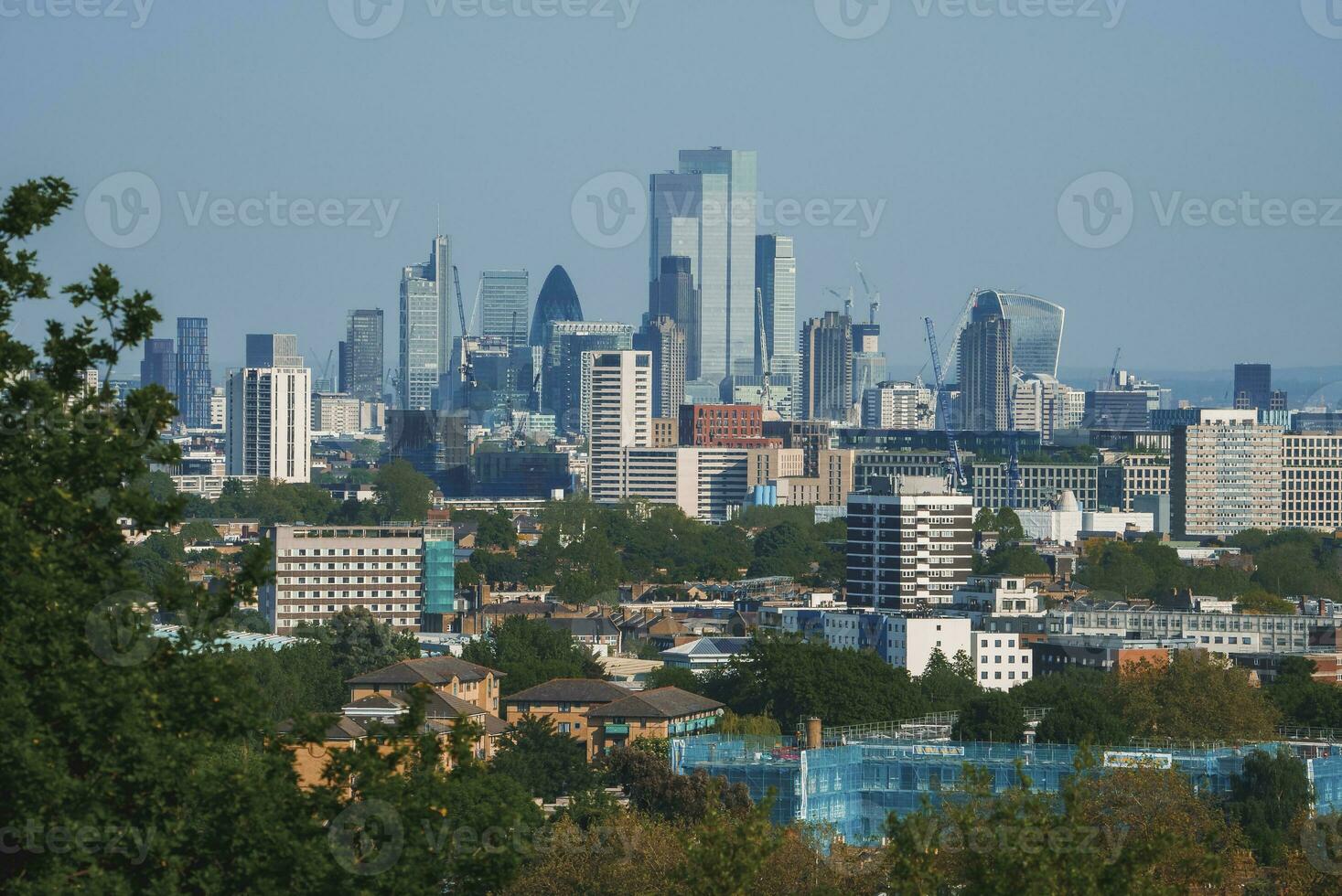 Modern and old buildings of cityscape with sky in background at London photo