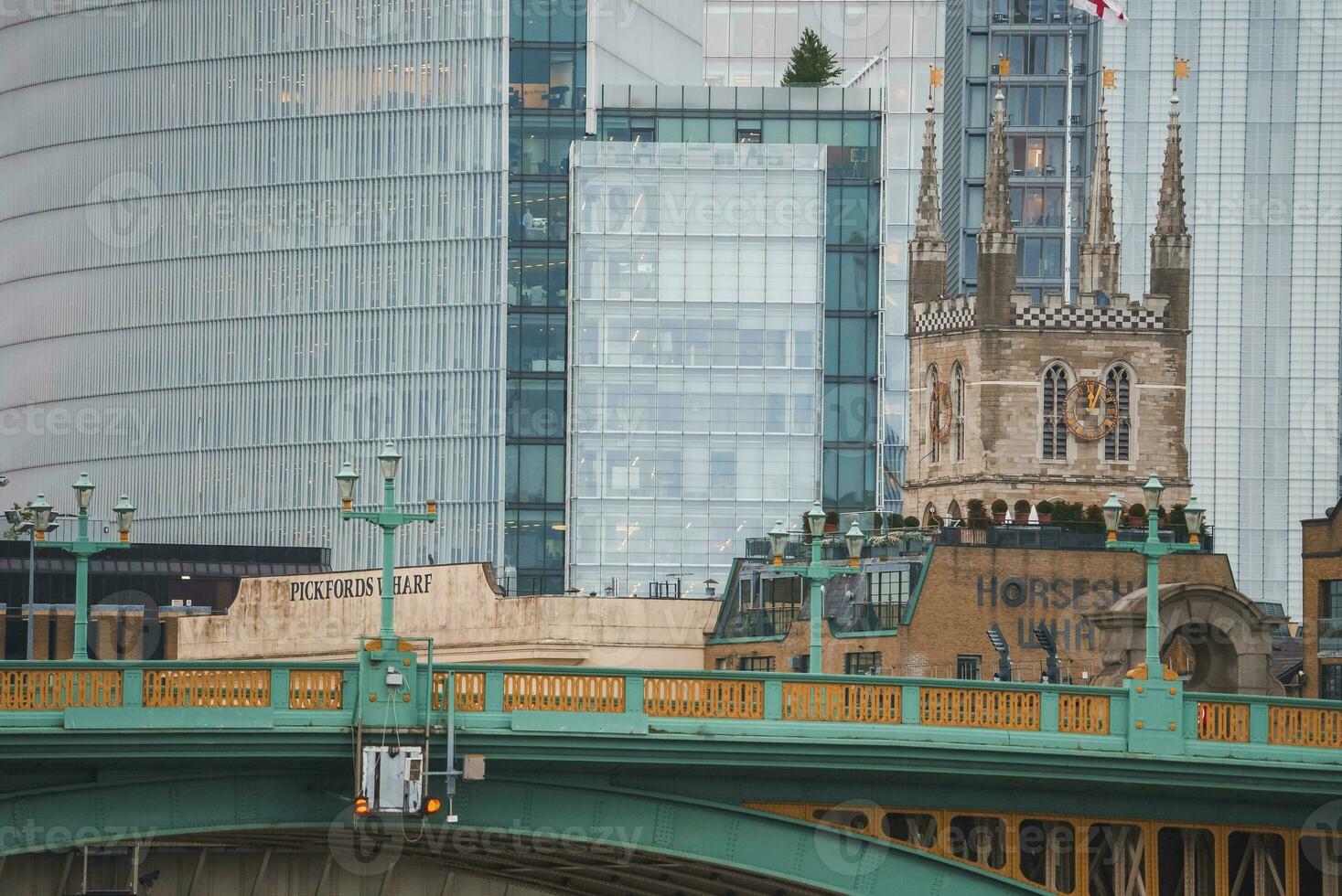 View of Southwark bridge and church with apartments and buildings in background photo