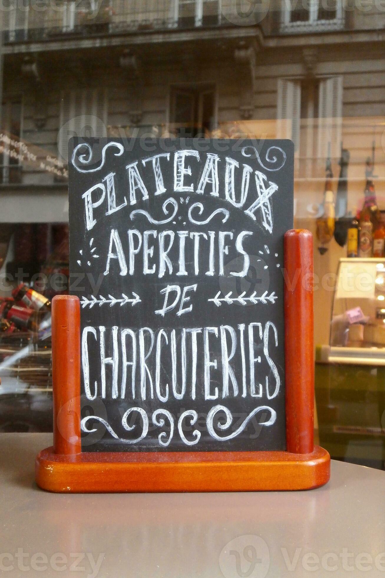 Writing slate with written in French meaning in English Aperitif