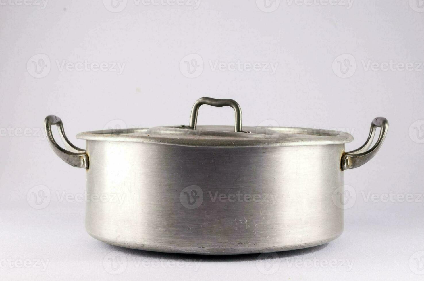 a large stainless steel pot with handles on a white background photo