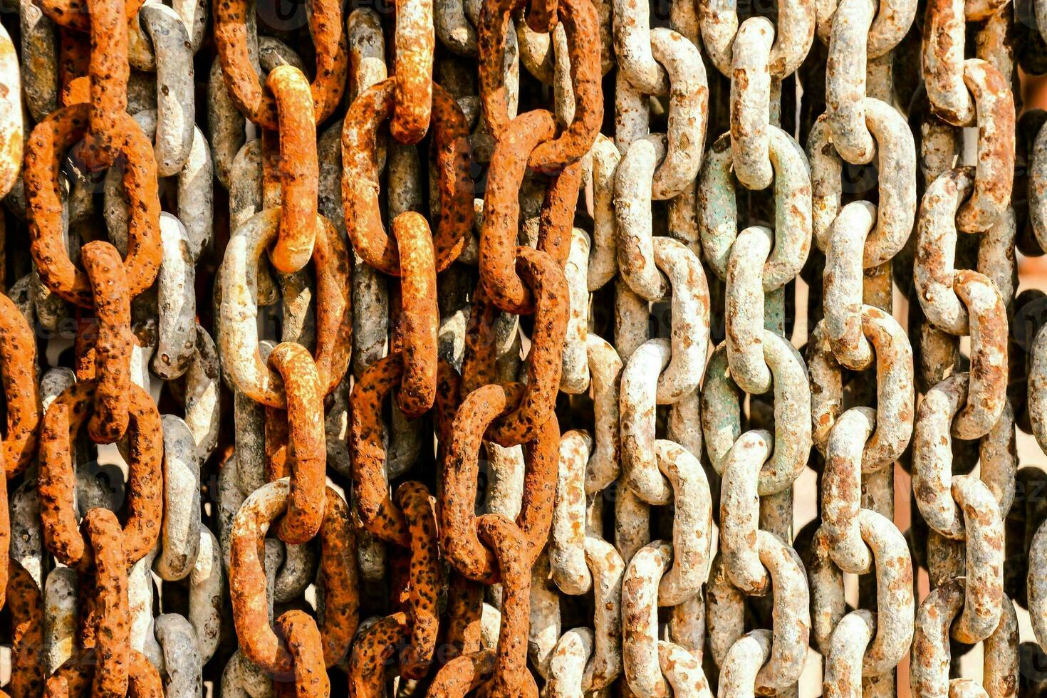 a close up of a chain link wall photo