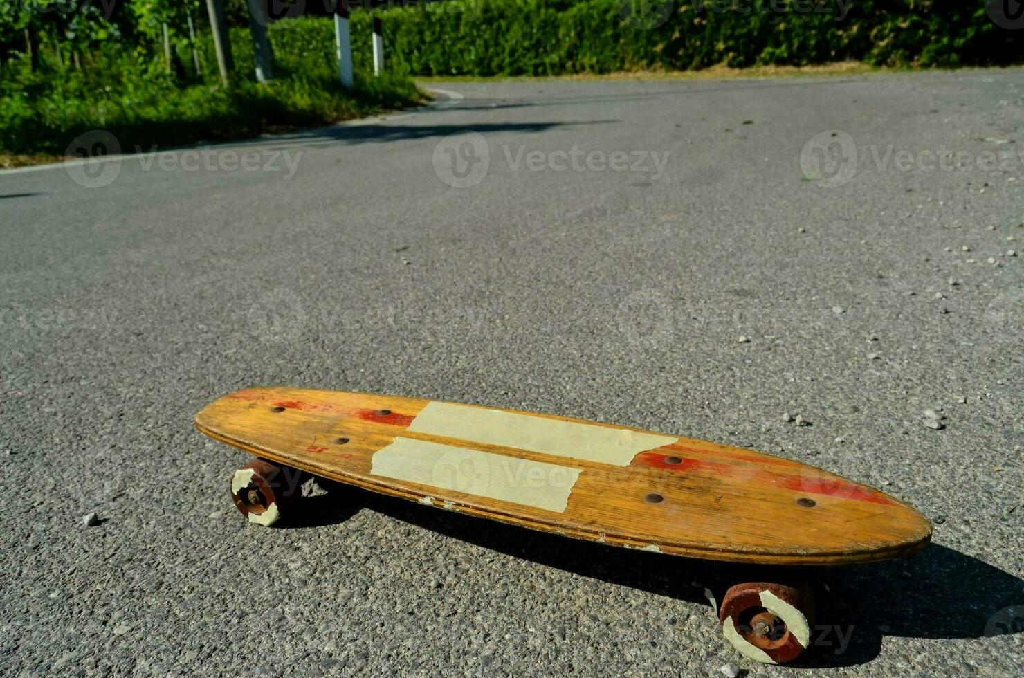 a skateboard with wheels on the ground photo