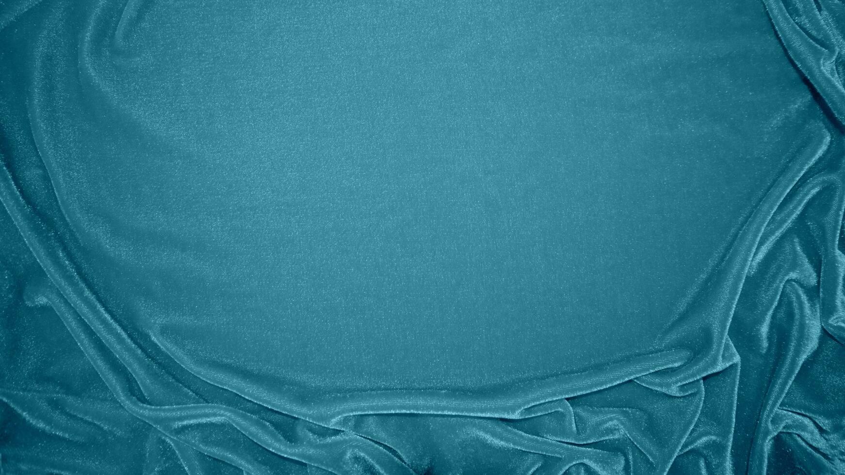 Blue velvet fabric texture used as background. Ocean color panne fabric background of soft and smooth textile material. crushed velvet .luxury navy tone for silk. photo