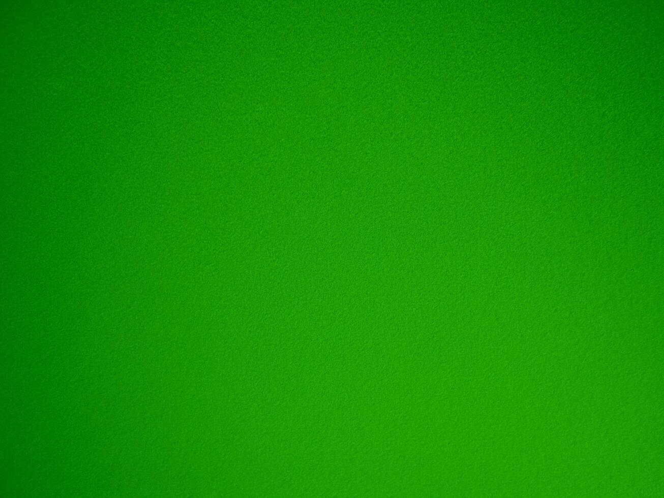 Felt green soft rough textile material background texture close up,poker table,tennis ball,table cloth. Empty green fabric denim background. photo
