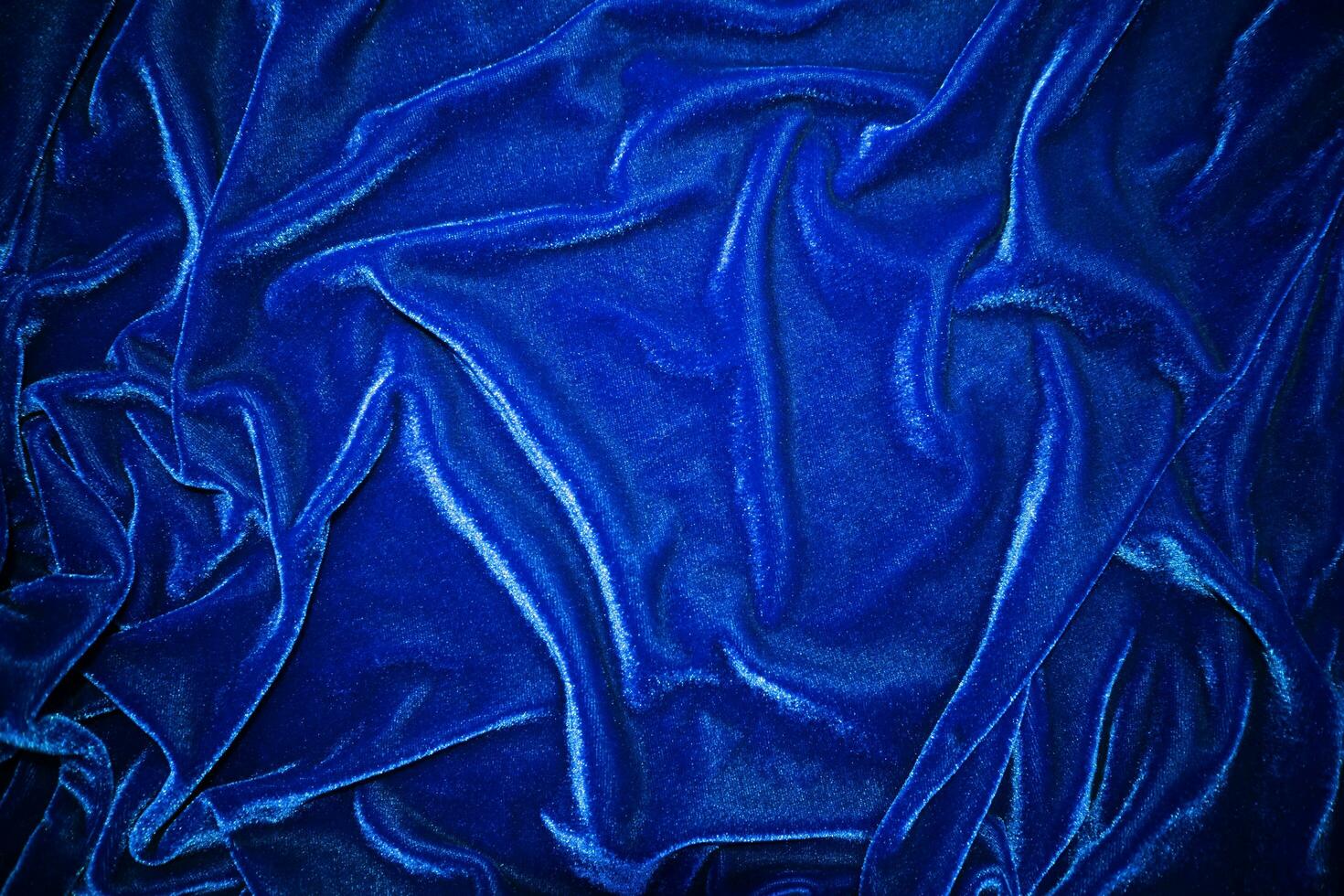 Dark bule velvet fabric texture used as background. Sky color panne fabric background of soft and smooth textile material. crushed velvet .luxury cobalt tone for silk. photo