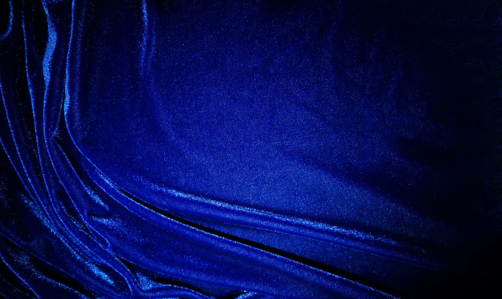 Dark bule velvet fabric texture used as background. Sky color panne fabric background of soft and smooth textile material. crushed velvet .luxury cobalt tone for silk. photo