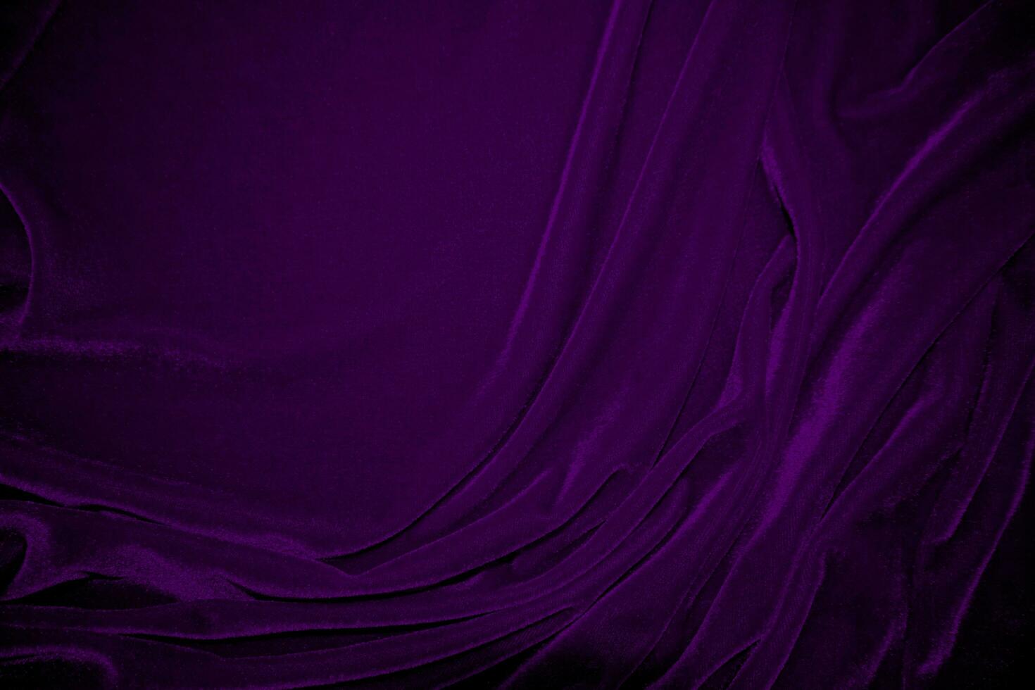 Purple velvet fabric texture used as background. Violet color panne fabric background of soft and smooth textile material. crushed velvet .luxury magenta tone for silk. photo