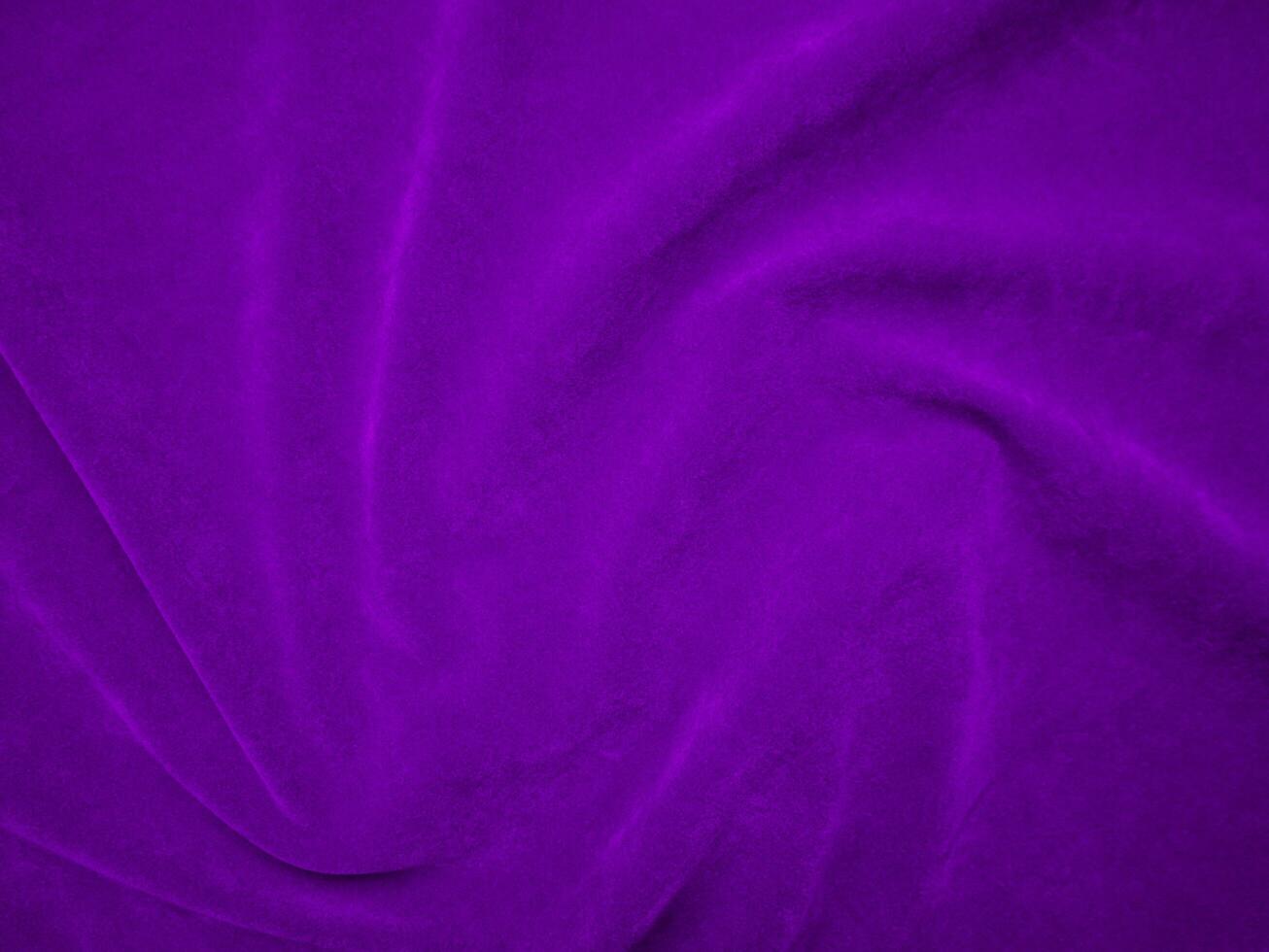 Purple velvet fabric texture used as background. Violet color panne fabric background of soft and smooth textile material. crushed velvet .luxury magenta tone for silk. photo