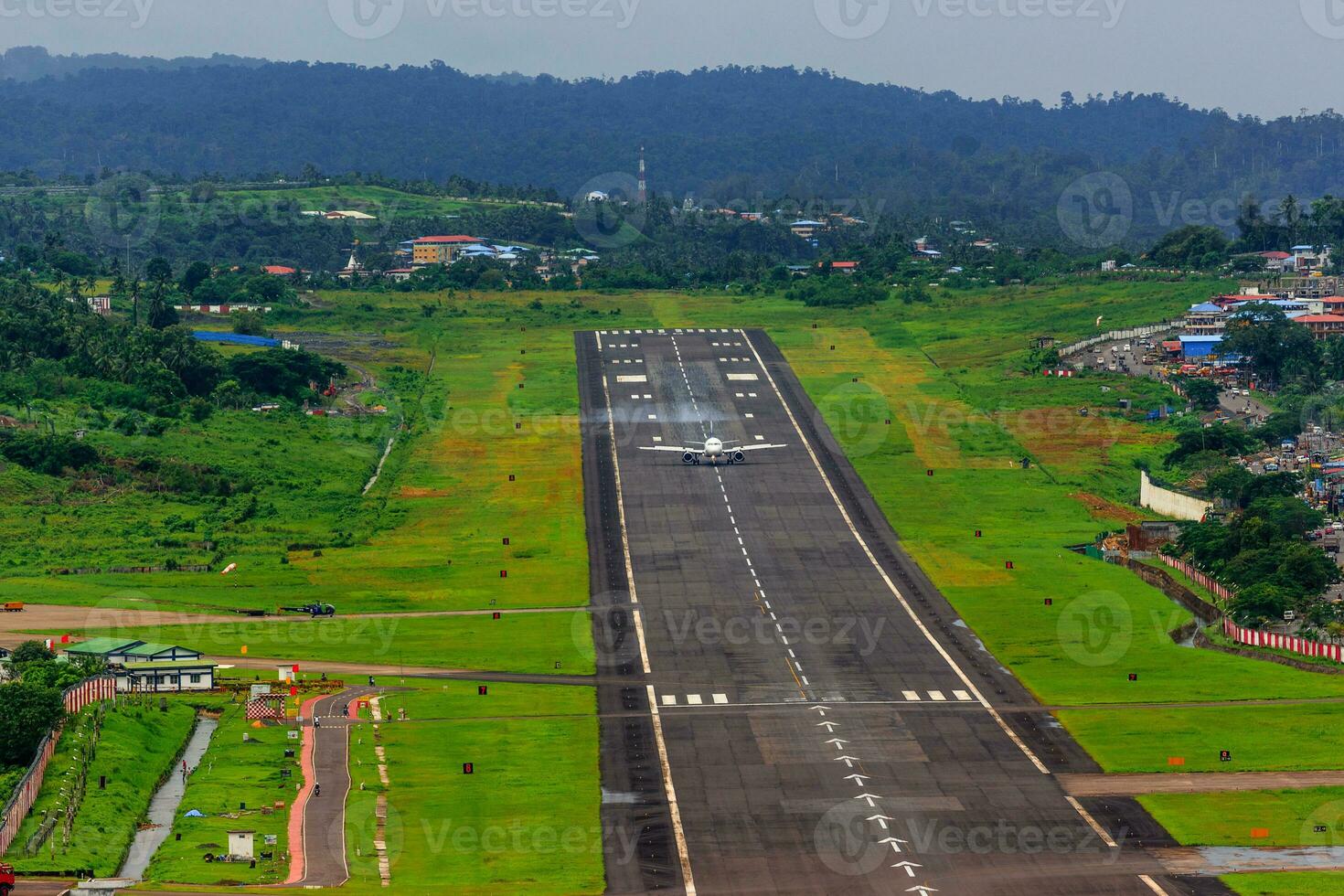An Airstrip with a plane on it photo