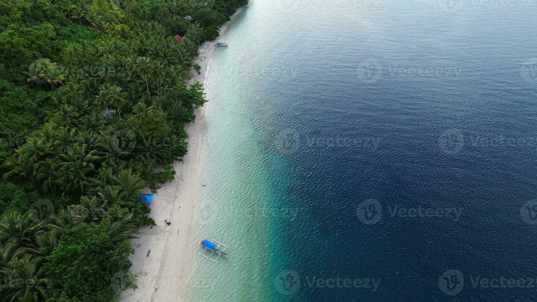 Summer seascape beautiful waves, blue sea water in sunny day. Top view from drone. Sea aerial view, amazing tropical nature background. Beautiful bright sea with waves splashing and beach sand concept photo