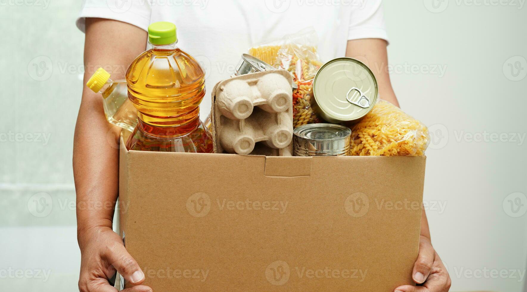 Foodstuffs in donation box for volunteer to help people. photo