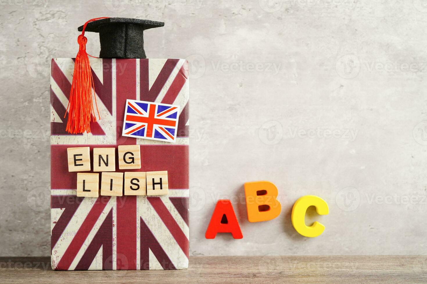 English book with graduate hat, learning and tutorial for foreigner. photo