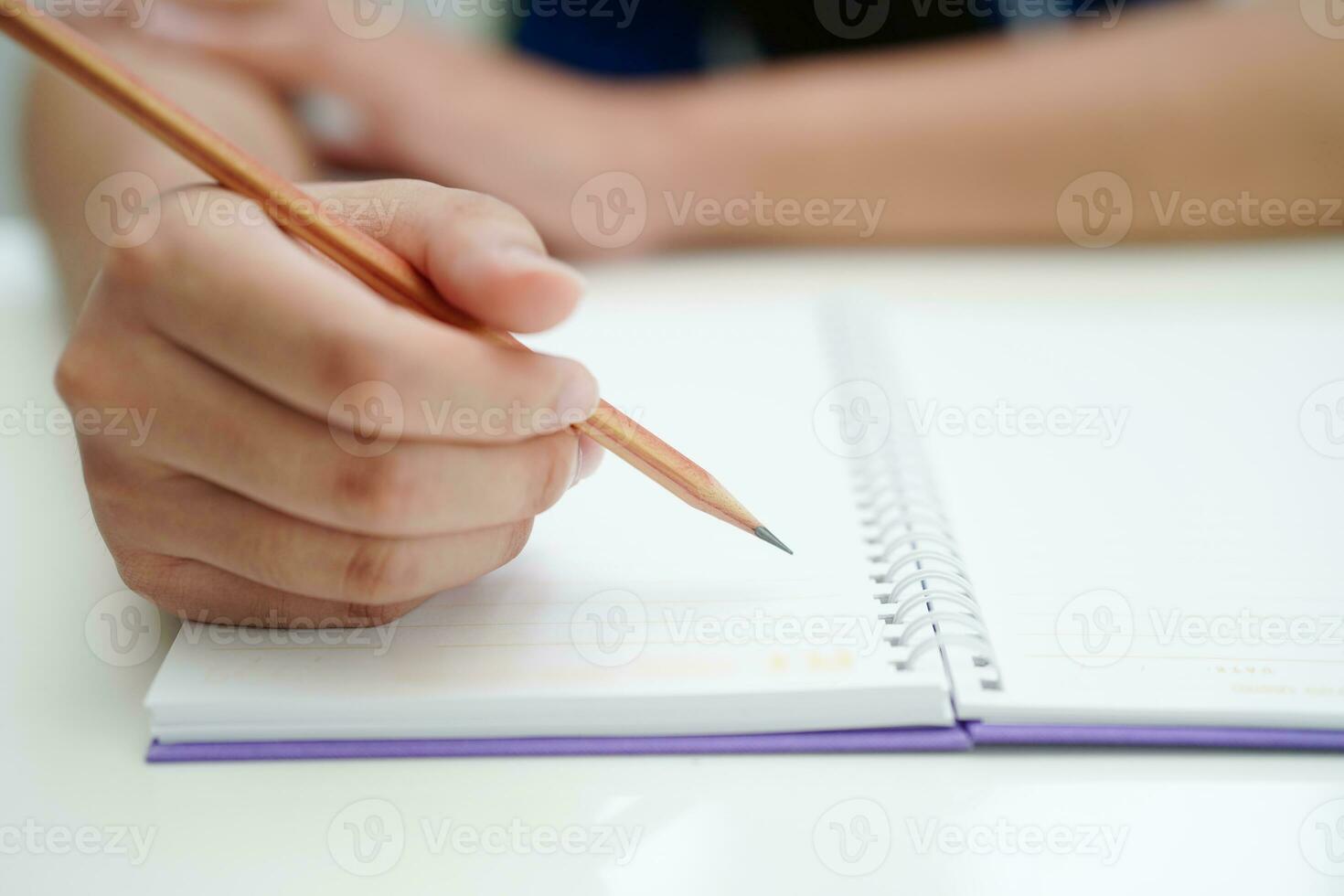 Asian teenage student write homework, study lesson for exam online learning education. photo