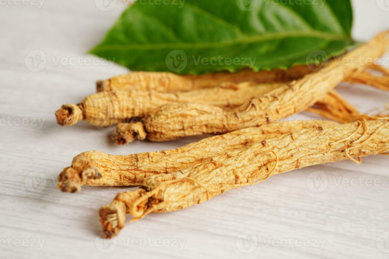Ginseng roots and green leaf, healthy food. 27252856 Stock Photo at