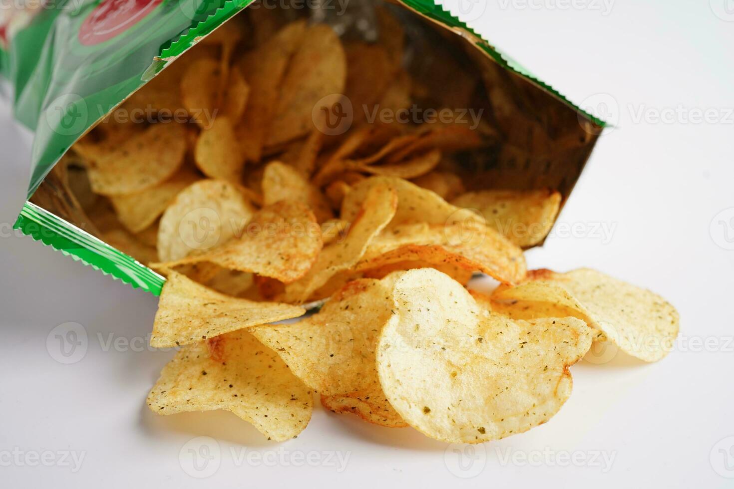 Potato chips in open bag, delicious BBQ seasoning spicy for crips, thin slice deep fried snack fast food in open bag. photo