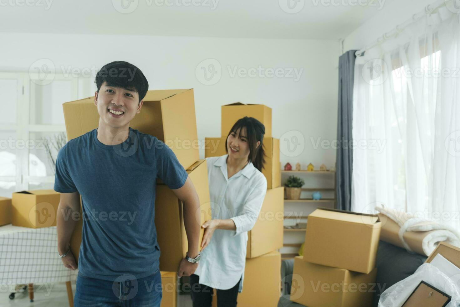 Asian young happy new married couple moving to their new house or real estate. photo