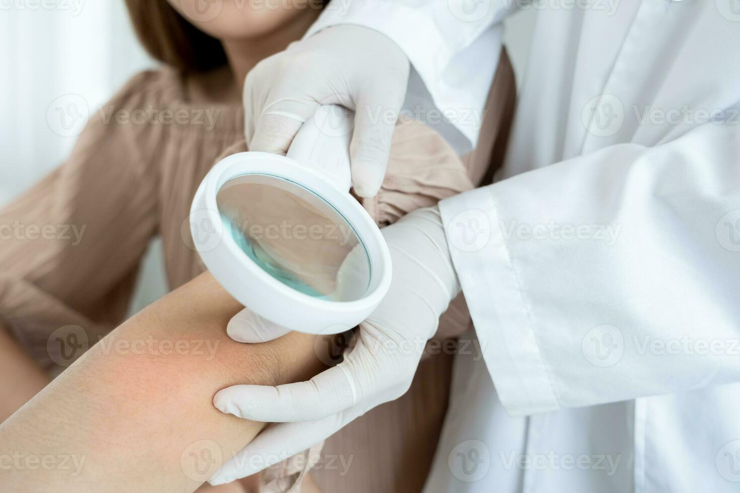 skin problem and beauty of asian girl. Dermatologist use magnifying glass look itchy skin from skin allergic, steroid allergy, sensitive skin, chemical allergy, rash, insect bites, Dermatitis. photo