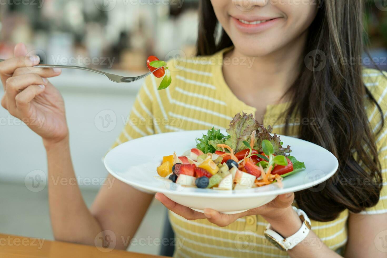 Diet and dieting, enjoy eat. Healthy woman hold salad food and feeling happy. Beauty slim female body achieves weight loss goal for healthy life, crazy about thinness, thin waist, nutritionist. photo