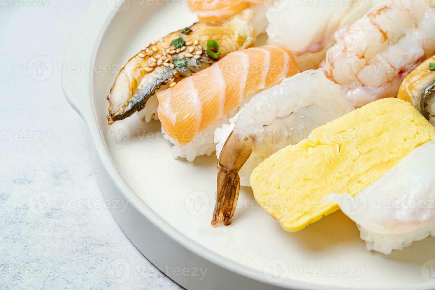 Fresh Japanese food sushi dishes on white plates photo