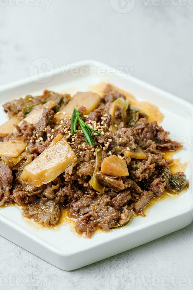 Bulgogi, korean food, Bulgogi is prepared with beef that has been marinated in soy sauce, honey, minced green onion, garlic, sesame seeds, and pepper, and then grilled. photo