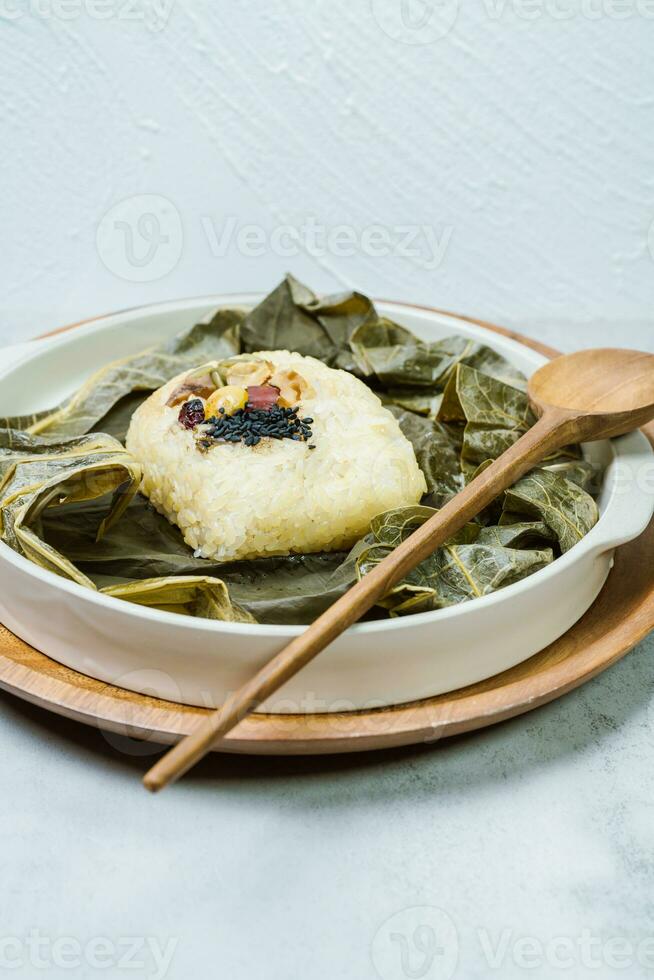 yeonnipbap, korean lotus leaf rice, Glutinous rice, dates, and chestnuts wrapped in a lotus leaf and steamed in a steamer. In the past, this dish was made and consumed by Buddhist monks, photo