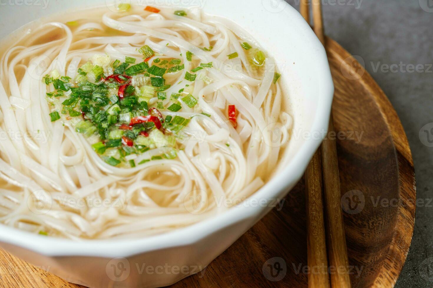 Vietnamese food rice noodle dish in a white bowl photo