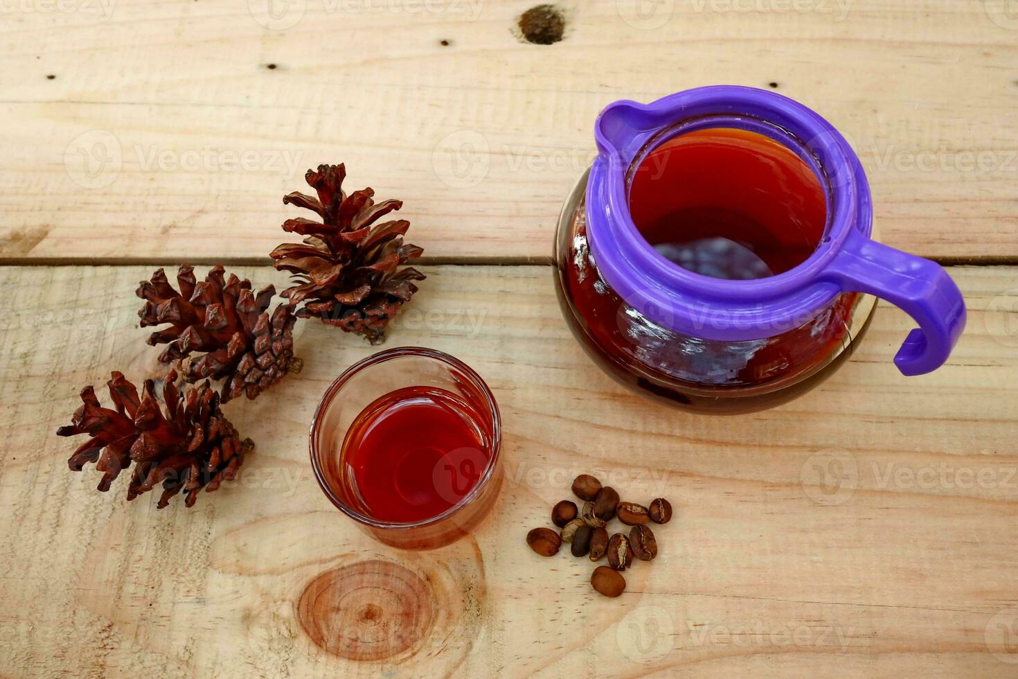 brewing coffee in a glass on a wooden table photo