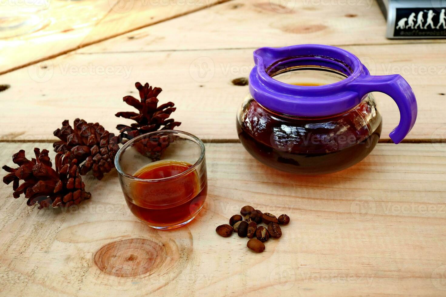 brewing coffee in a glass on a wooden table photo