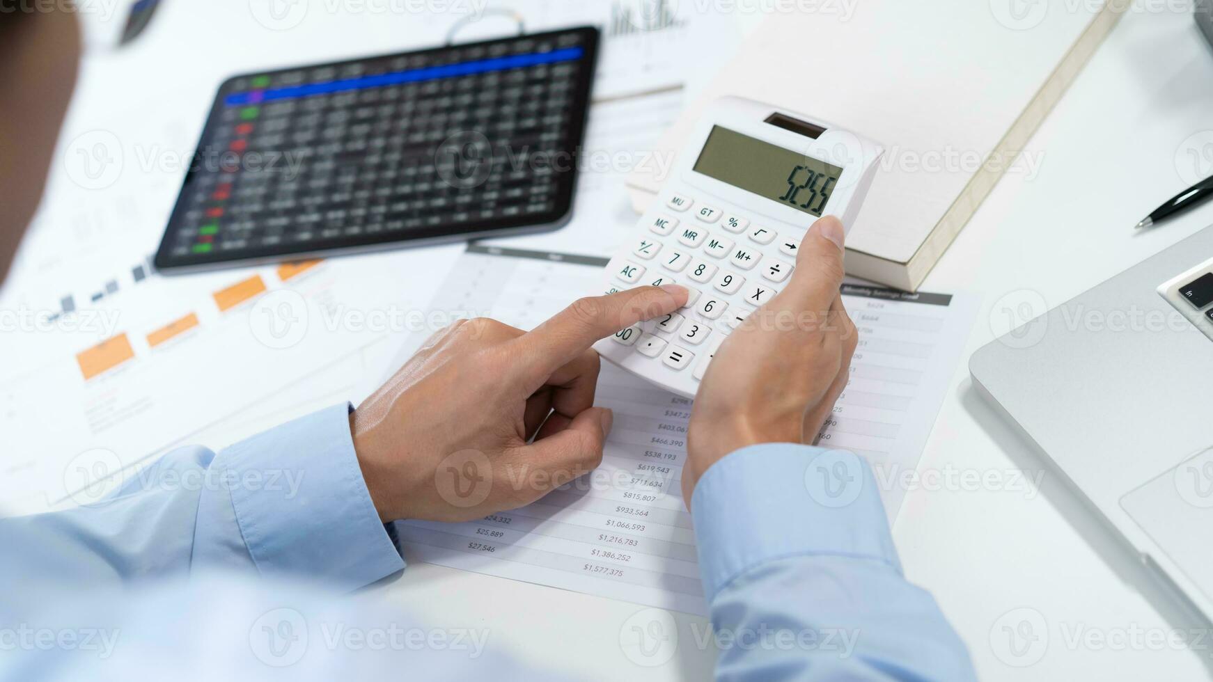 Saving money. Businessman Accountant verify growing business and saving money stacking coins with calculator. Accountancy Concept. photo