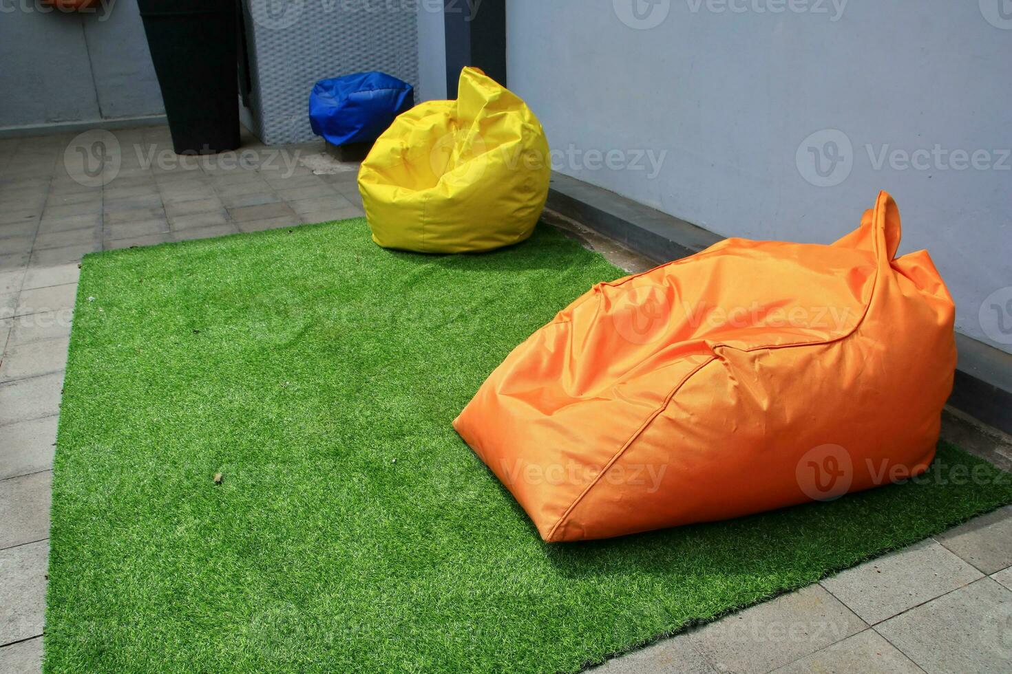 Bean Bag is a chair filled with styrofoam beads and without a frame